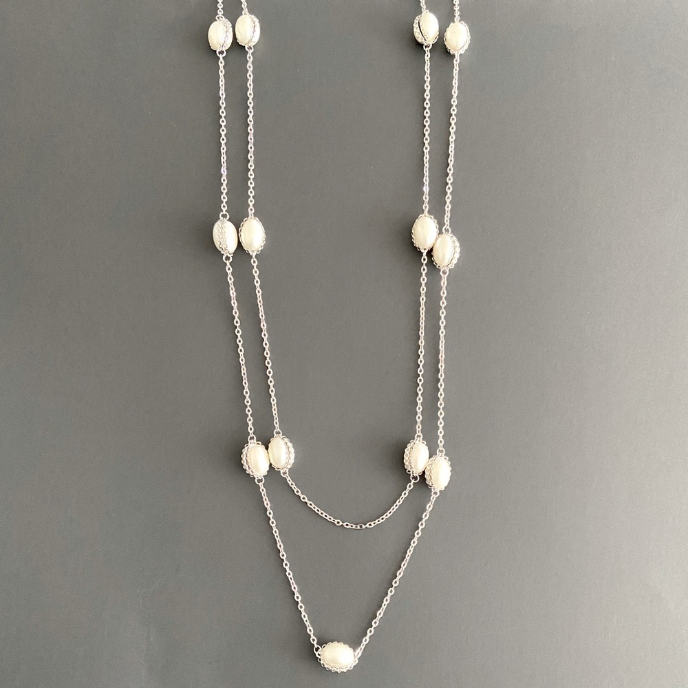 long pearl and silver tone chain necklace.